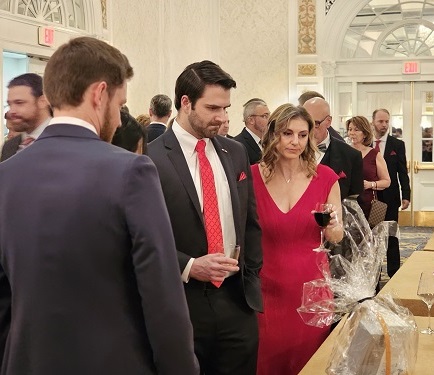 Guests looking at silent auction packages